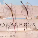 lunettes de vue femme osmose métal fines or et or rose opticiens saint-gilles